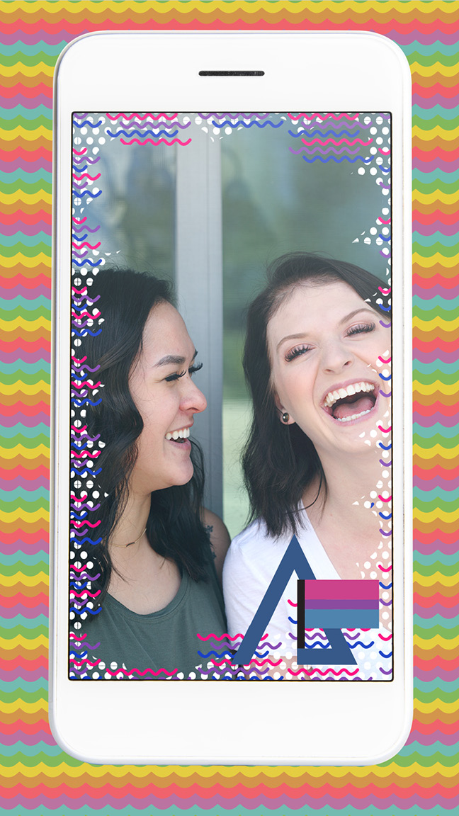 A phone, featuring an image filter of the bisexual pride flag overlaid on top of an image of two women laughing together.